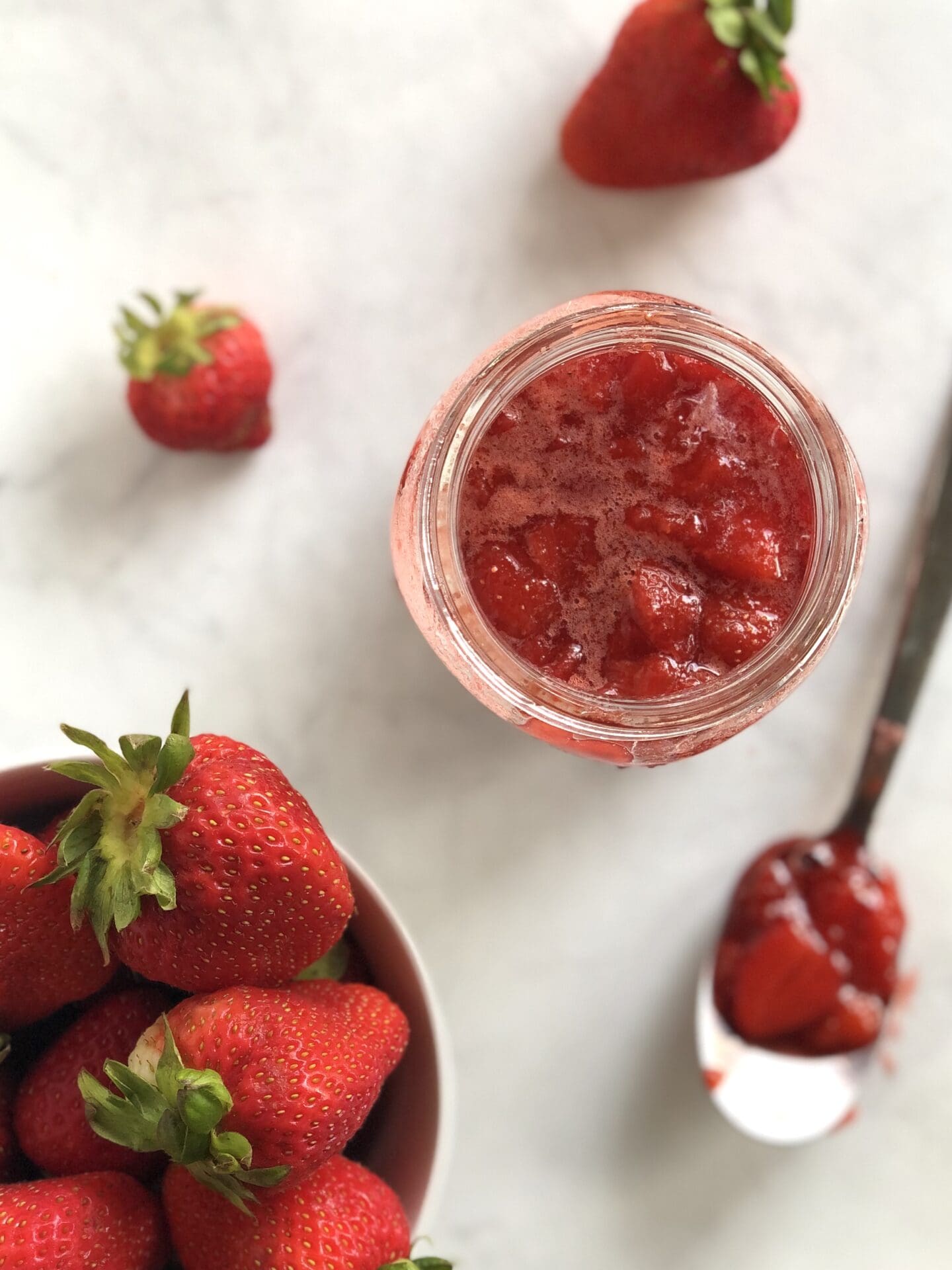 2E838FE6-50B7-42E3-90B5-6C20FCD92D01 Strawberry sauce with fresh strawberries seen from above