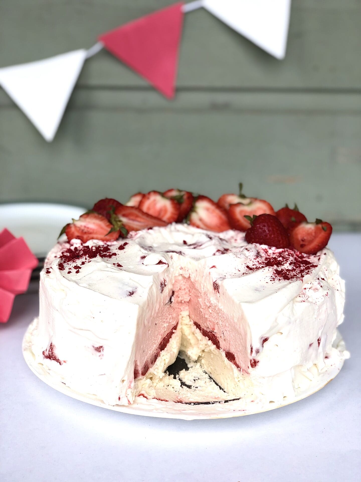 5825A783-EF8A-4AE6-A14A-BF4C053CE040 Strawberries and Cream Ice Cream Cake with slice removed to reveal layers