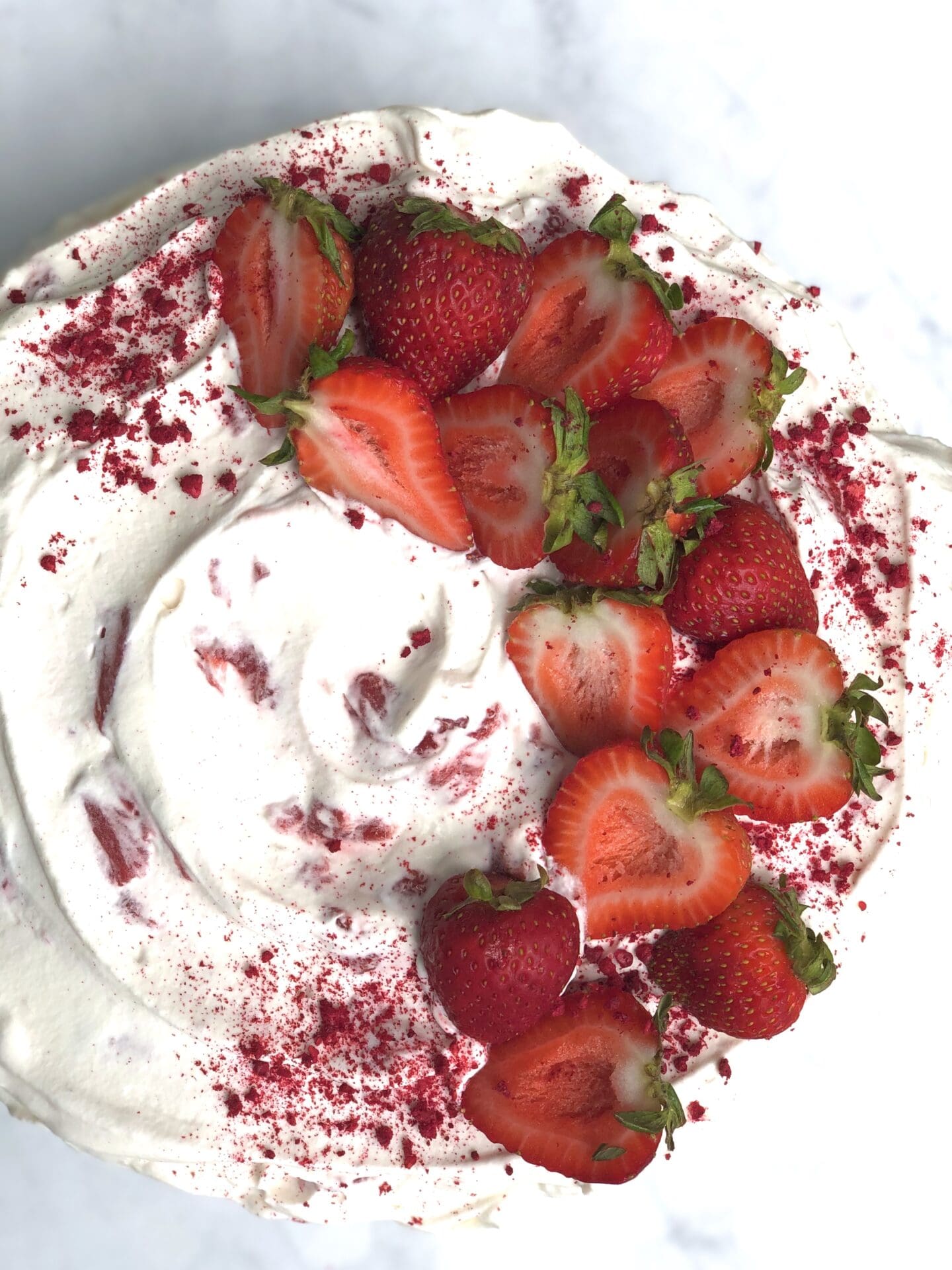 6EA43375-AF50-4995-B87E-A1F1185DDC8A Beautifully decorated strawberries and cream cake seen from above