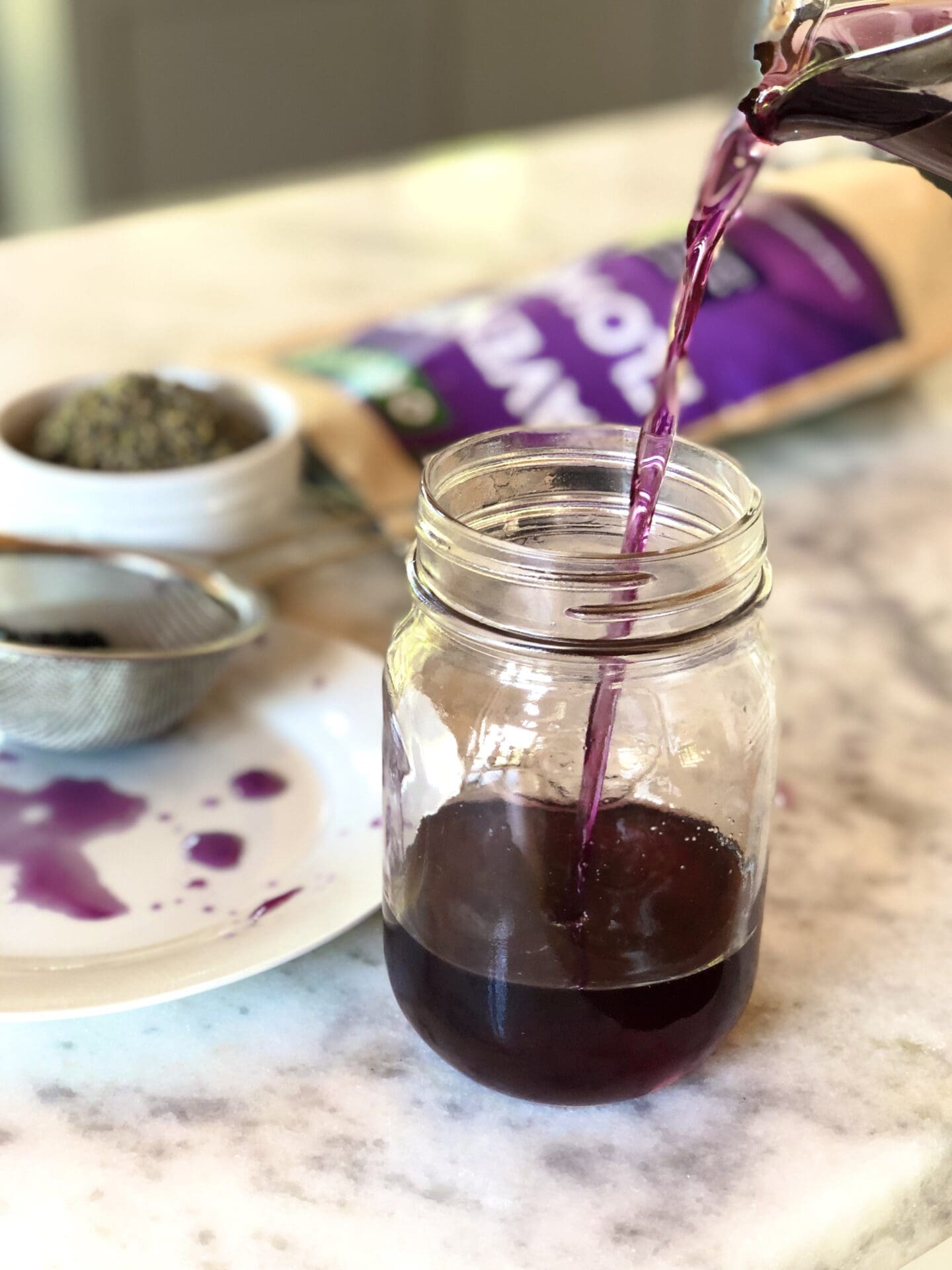 0981B59F-397E-4B84-BE9C-2E7D4A0057DC Blueberry lavender syrup poured into a mason jar