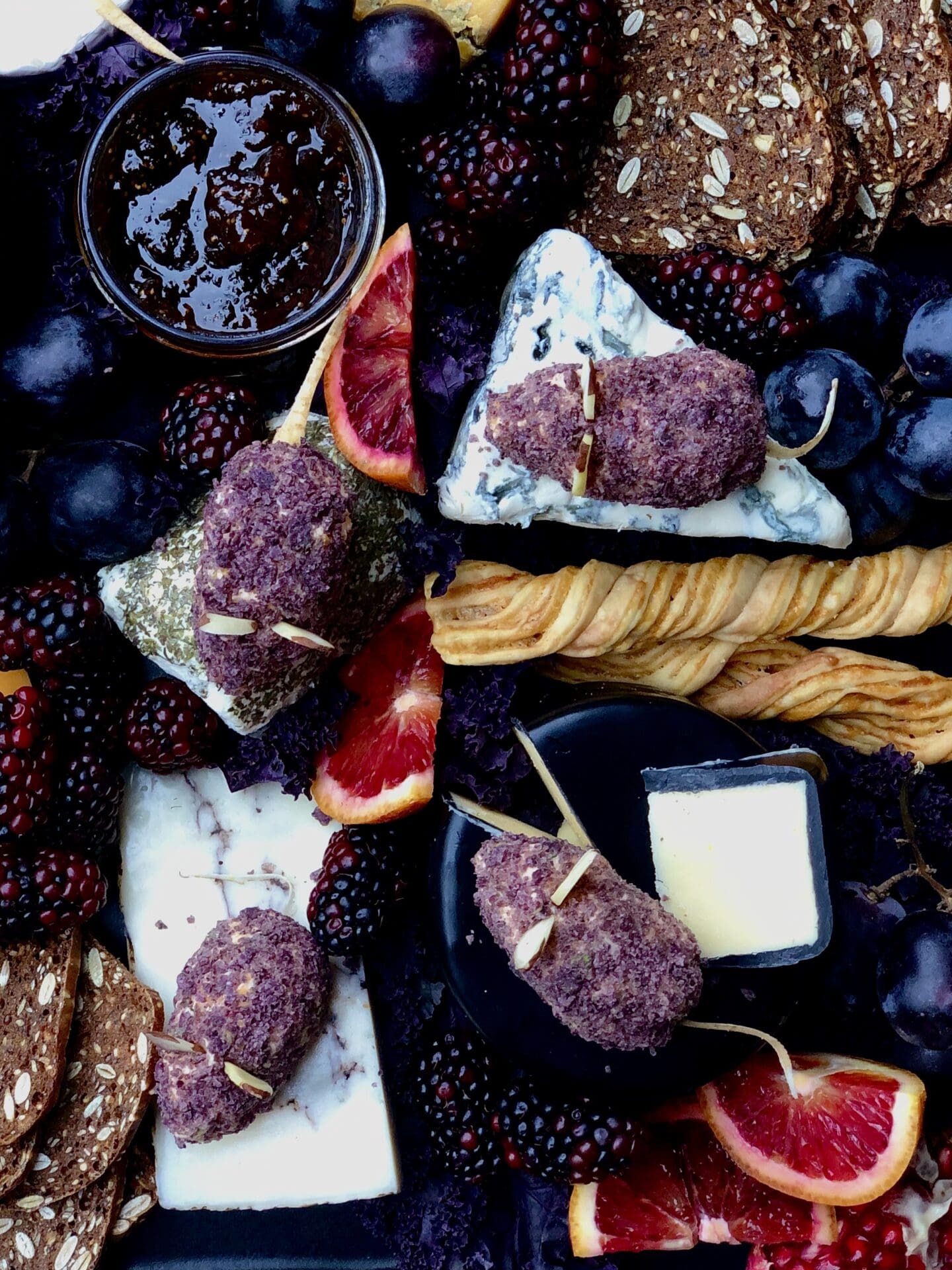 32BC5123-3E95-44F8-BE8E-0885DF87C971 Cheddar Cheese Mice on a dark and moody Halloween themed cheese platter