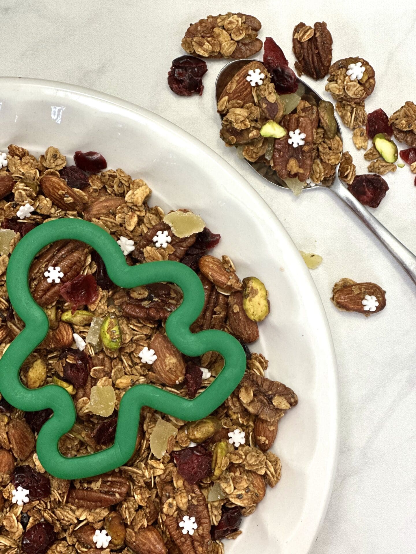 69100917-3A59-4FD1-B7C0-A79A91CAA0C5 Homemade gingerbread granola with dried cranberries and snowflake sprinkles