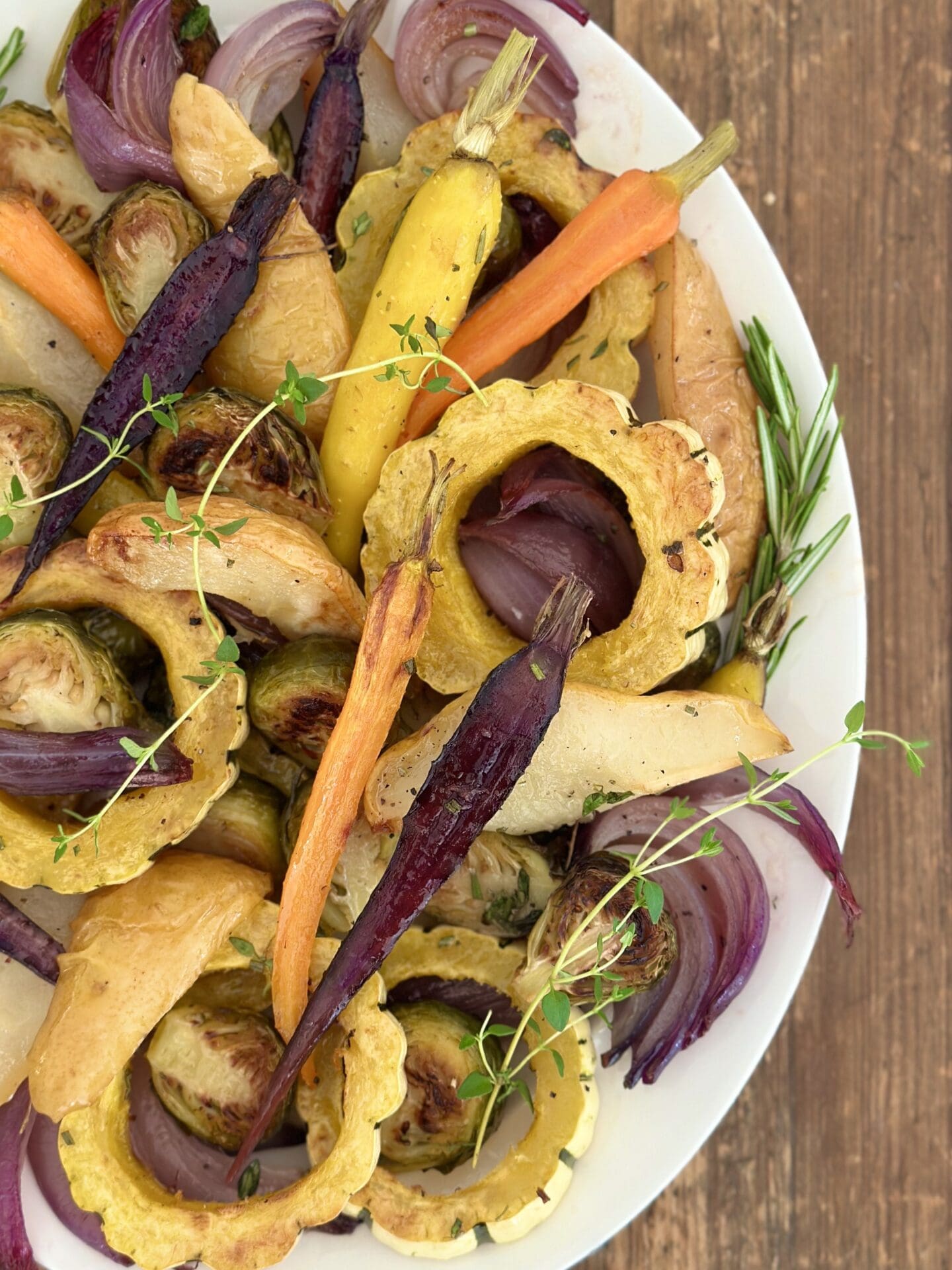 IMG_9430 A Thanksgiving side dish of colourful Maple Butter Roasted Vegetables with Pears garnished with fresh herbs