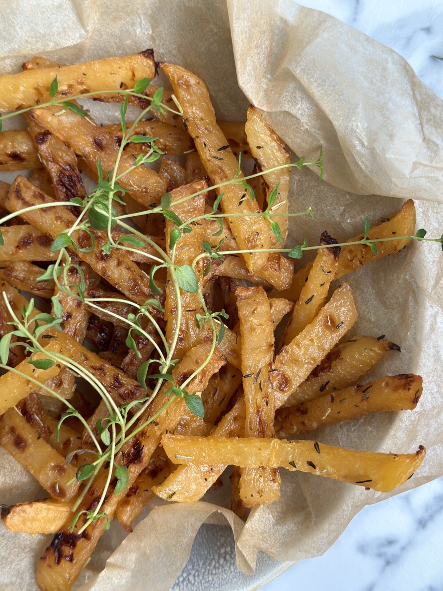 IMG_9705 Oven roasted rutabaga fries seen from above, garnished with fresh thyme