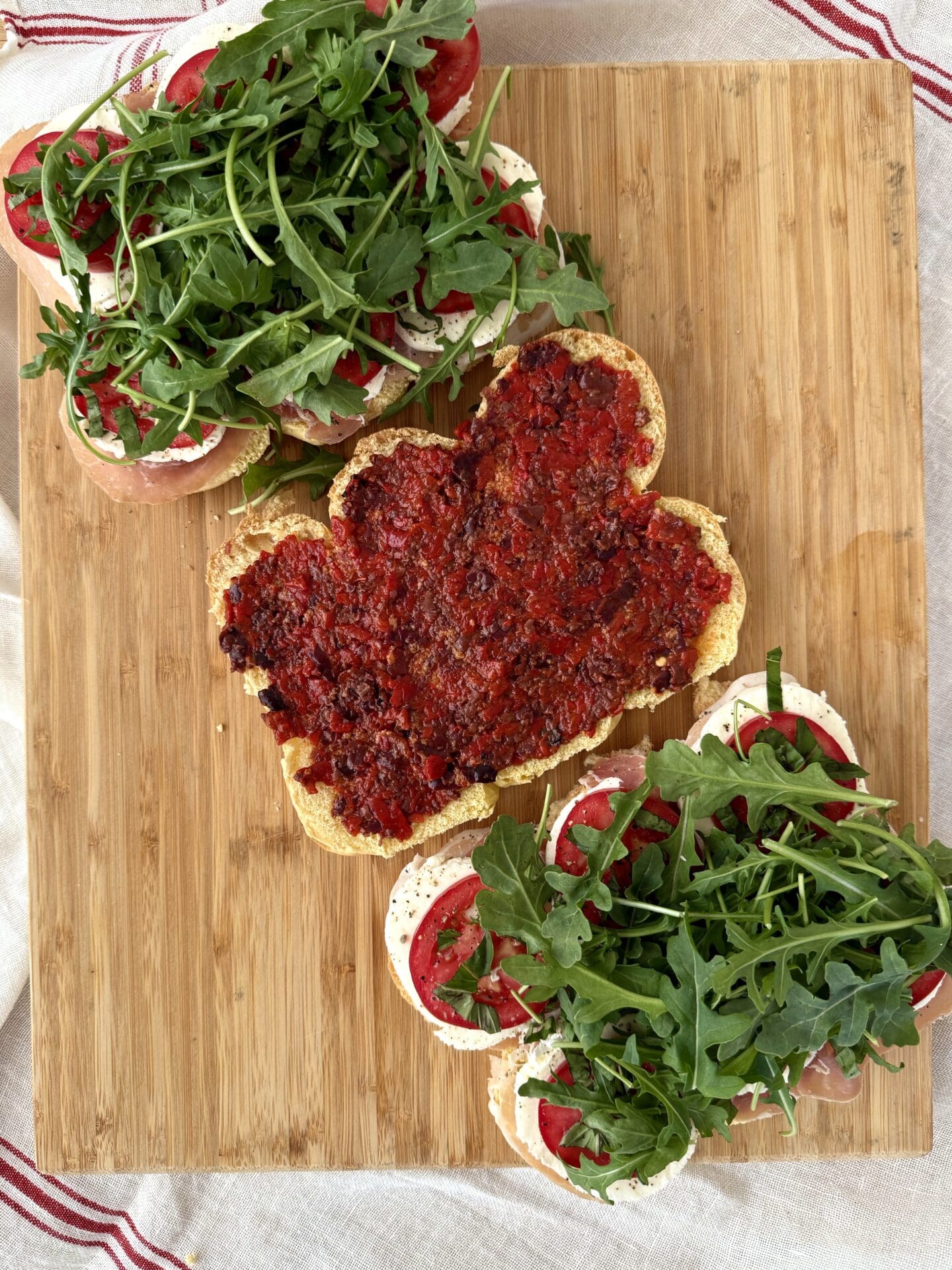 IMG_5031 A roasted red pepper and black olive sauce is spread on the top buns for Italian Antipasto Sliders.