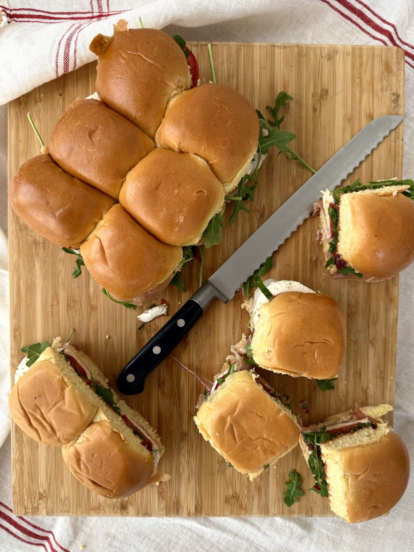 IMG_5041 Italian Antipasto Sliders are assembled and cut into individual sandwiches.